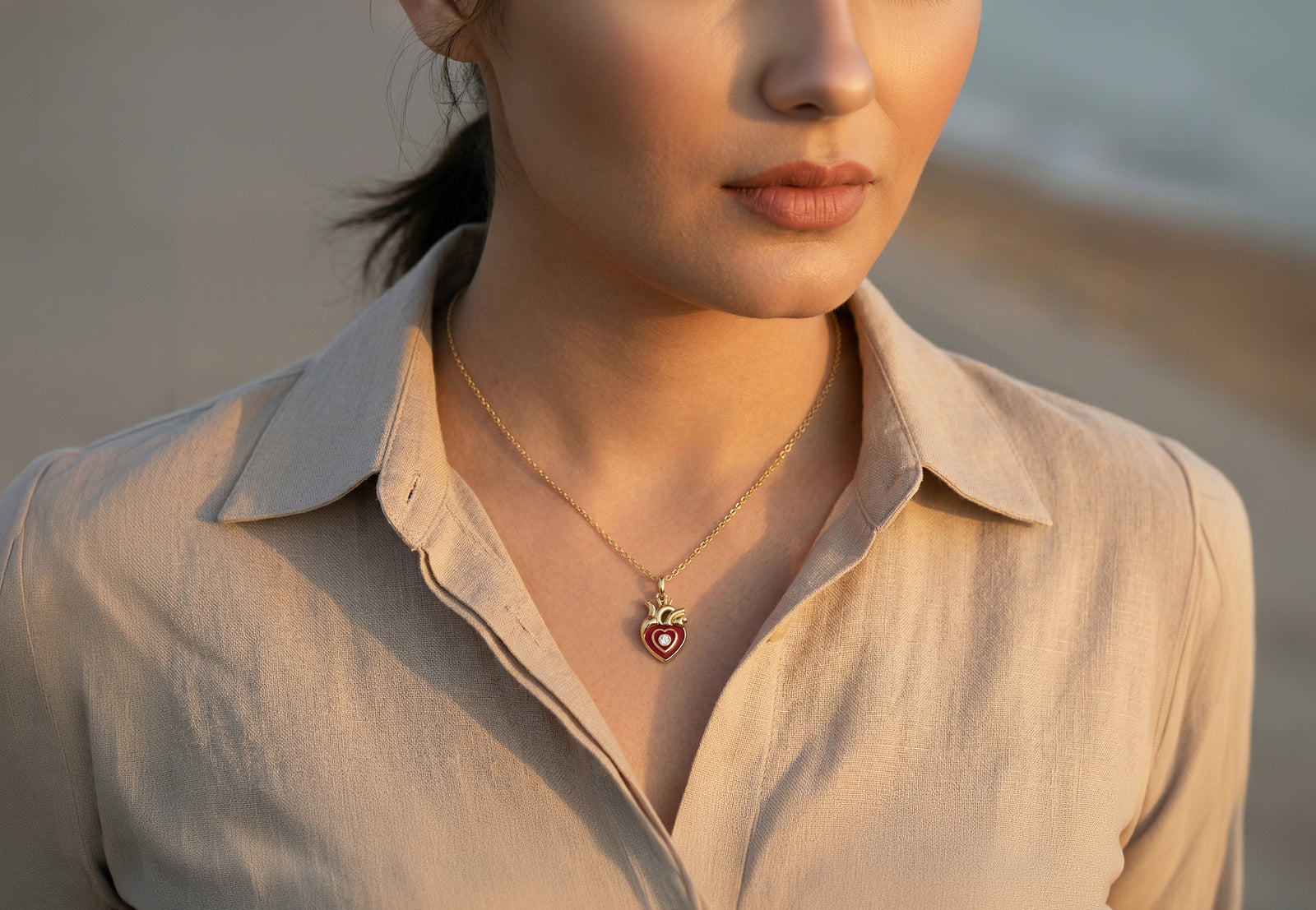 Blissed pendant worn open-collar